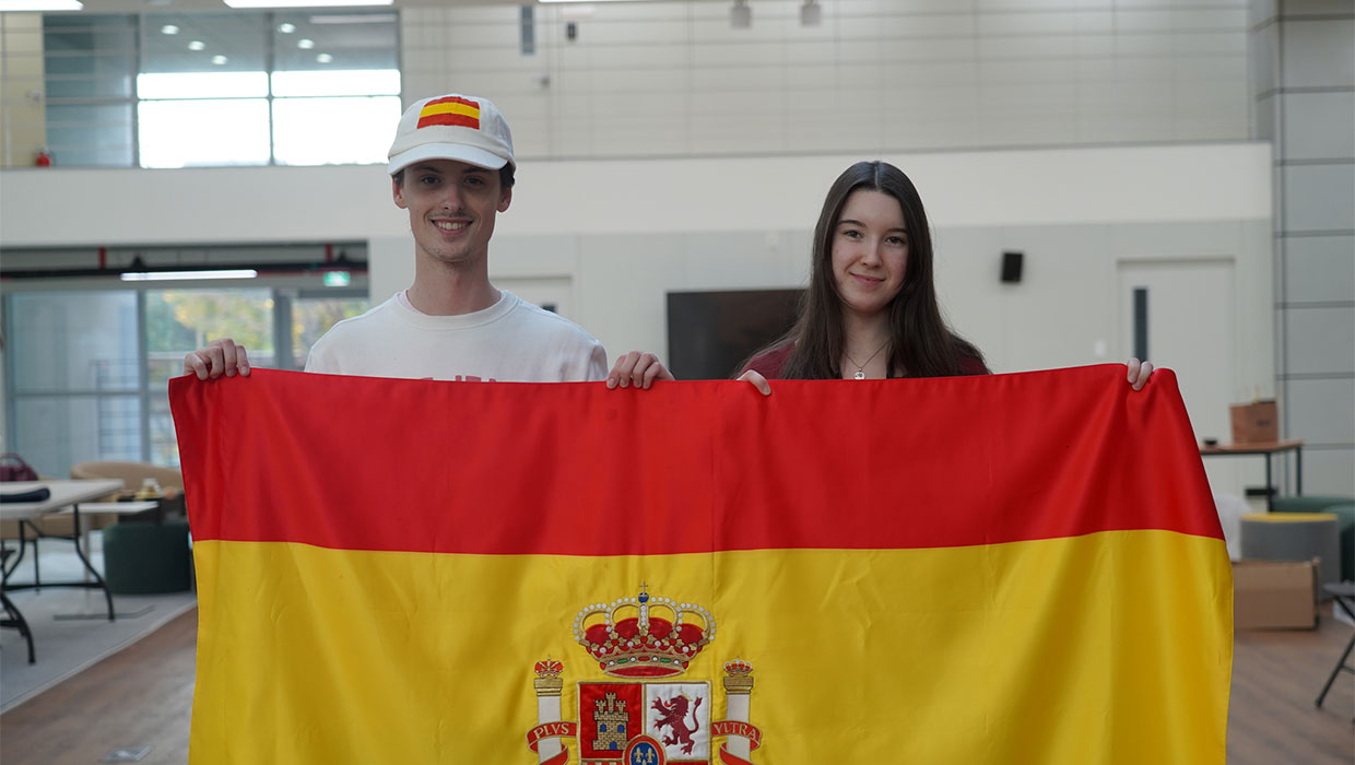 Students from the University of  Málaga, studying as exchange students at  Incheon National University, hold the Spanish flag.
